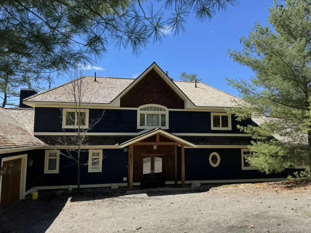 Cedar Roof Cleaning in progress at a Muskoka property