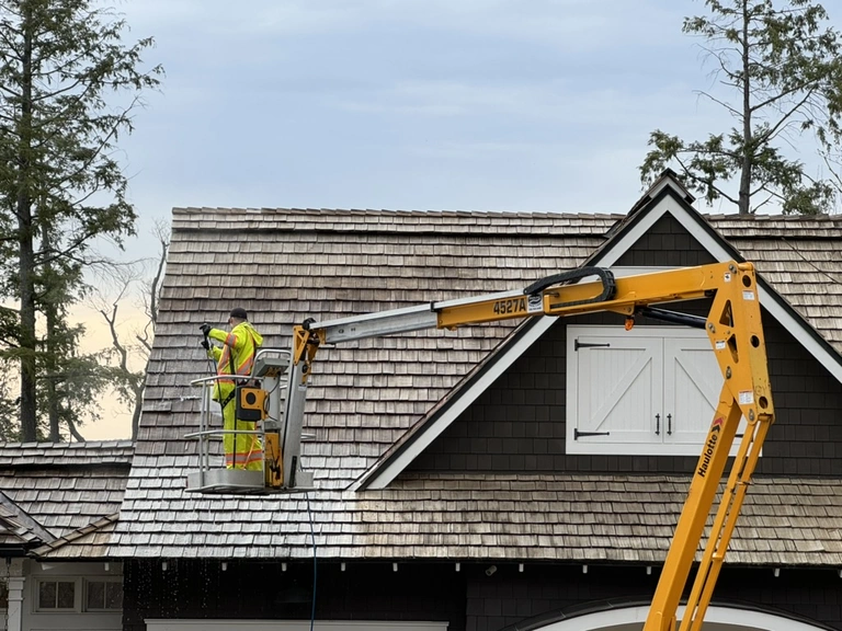 Brite Surface Cleaning providing a cedar roof cleaning service in Muskoka