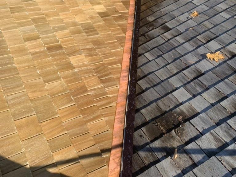 Cedar shake roof sections before and after cleaning